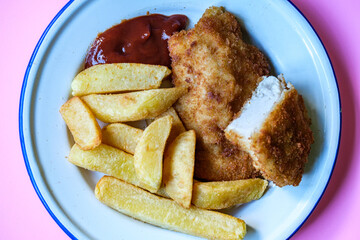 Breaded Chicken Fillets With Chuncy Chips And Tomato Sauce