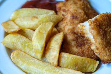 Breaded Chicken Fillets With Chuncy Chips And Tomato Sauce