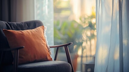 Comfortable armchair with orange pillow