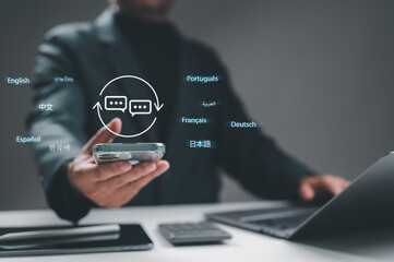 Professional holds smartphone, digital language translation icon floating above. Global communication, multilingual interface, international business concepts. Modern technology facilitates diverse