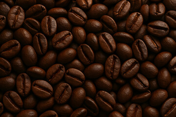 Naklejka premium Roasted Coffee Beans Background: A Rich, Dark, Textured Pattern