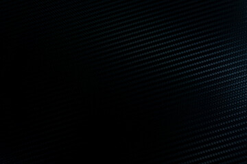 abstract blue black background. close-up of a carbon fiber pattern, black abstract background.