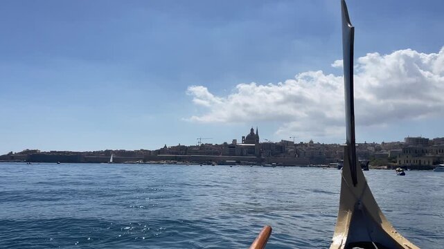 Riding the boat between Silema and Valetta overlooking cathedral
