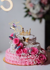 quinceanera cake and decoration with flowers