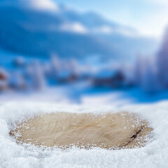 Empty copy space on fresh snow with background of frozen winter mountains and clear blue sky on sunny day. Concept of winter holidays, seasonal product placement, cold weather and mountain nature.