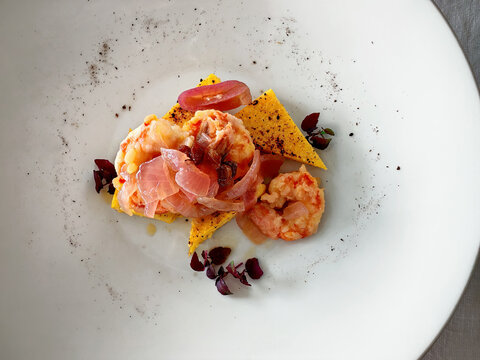 Shrimp in saor appetizer with toasted polenta