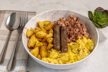 breakfast bowl with  corn beef hash  and sausages