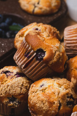 Blueberry muffins on a rustic table in a mold