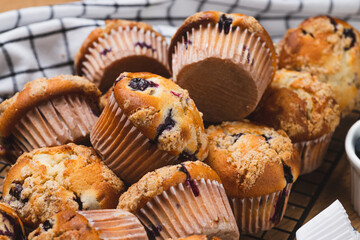 Blueberry muffins on a rustic table in a mold