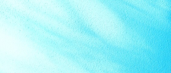 An abstract background of a textured wall with subtle shadows, bathed in a refreshing and bright light blue hue.