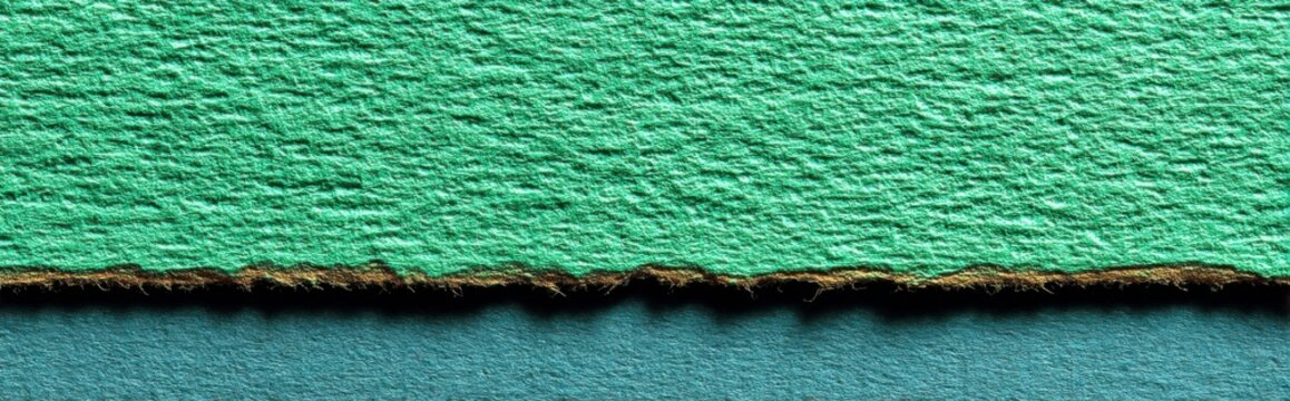 Eye-catching green wall with a distinctive hole in the middle surrounded by a pastel mint field highlighting faint paper fibers and subtle shadows for an artistic touch