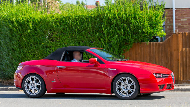 Bletchley,Bucks,UK - Aug 25th 2025:  2007 red Alfa Romeo Spider jts car driving on a British road
