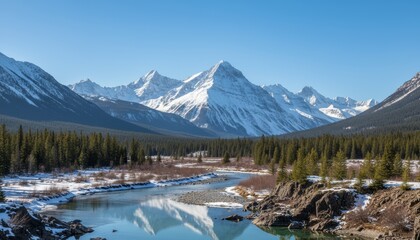 Wide shot of snow-capped mountains under clear blue sky, natural scenic view