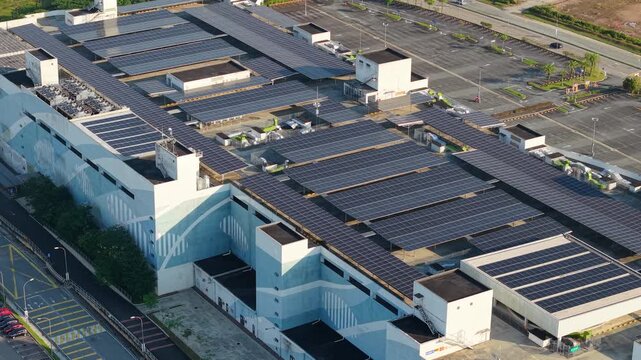 Aerial View of Shopping Mall Parking Lot with Solar Panel Rooftop in Malaysia