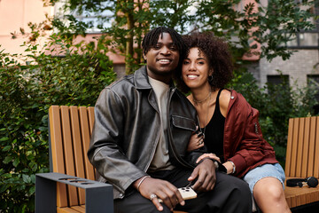 Fototapeta premium Young couple enjoys a date in the city while dressed in stylish attire together