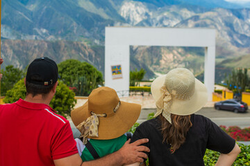 Family traveling in Colombia looking at mountain landscape