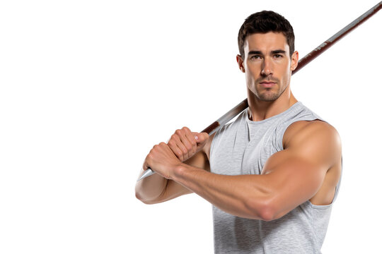 Serious young male athlete holding a javelin over his shoulder, ready for a throw during a track and field competition