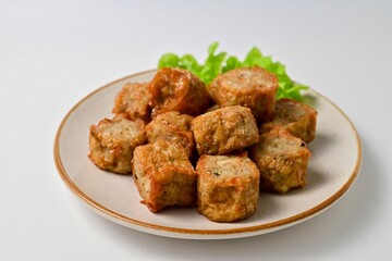 Deep Fried Crab Meat Roll, thai called hoi jo in a white plate