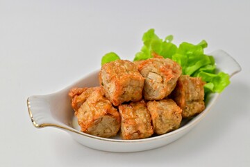 Deep Fried Crab Meat Roll, thai called hoi jo in a white plate
