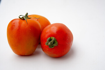 ripe red tomatoes isolated on white background
