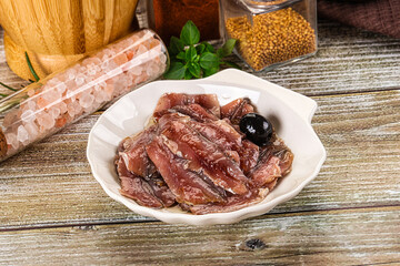 Canned anchovy with oil in the bowl