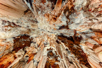 Natural stalactite formations on the ceiling of an underground cave