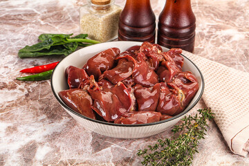 Raw uncokked chicken liver in the bowl