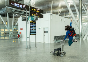woman jumps inside the airport