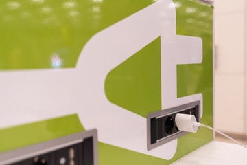 I charge my device at a charging point at the airport.