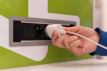 I charge my device at a charging point at the airport.