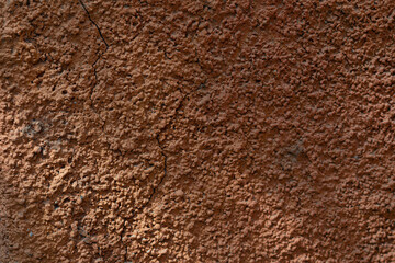 Wall with texture and shadows. Orange, brown concrete background