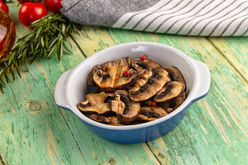 Tasty hot grilled champignon mushrooms