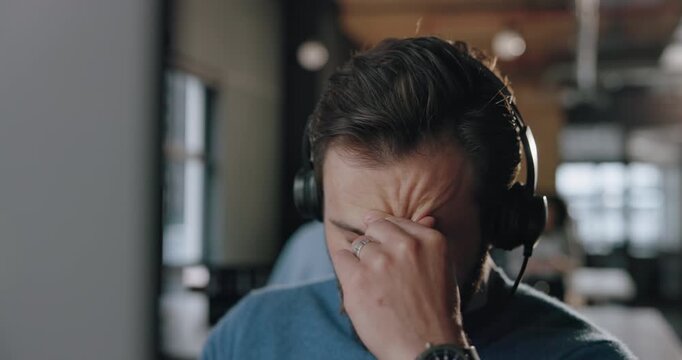 Computer, man and stress with headset in call center for 404 glitch, tech support issue and crisis. Coworking, frustrated agent and PC with pressure for difficult client, customer service and burnout