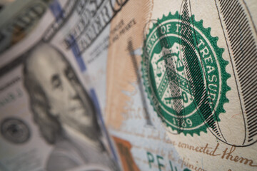 Close-up of Benjamin Franklin on a 100 dollar banknote.