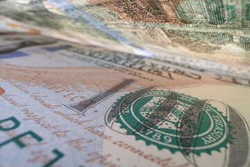 A close-up of a 100 dollar banknote.