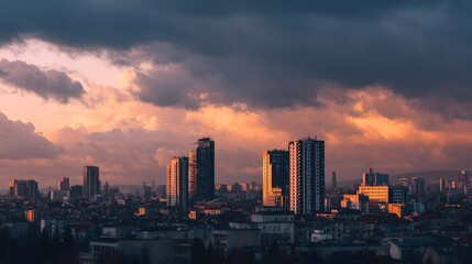 Fototapeta premium City Skyline at Sunset with Dramatic Clouds