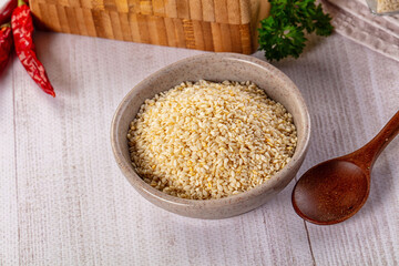 Raw dry sesame seeds heap