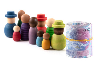 Rolled up 10,000  Kazakhstani tenge bills and a group of symbolic people