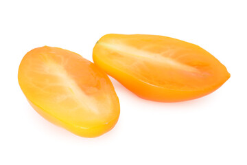 Pieces of ripe yellow tomato isolated on white