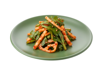 Vibrant, colorful, and flavorful dish of seasoned greens and root vegetables served on a muted sage-green plate.
