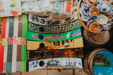 Vietnamese Souvenir Display Featuring Lacquerware Trays and Ceramic Trinkets