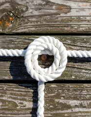 White Rope Knot on Wooden Dock