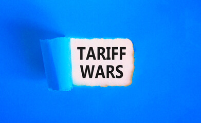 Trade tariff wars symbol. Concept word Tariff wars on beautiful white paper. Beautiful blue paper background. Business trade tariff wars concept. Copy space.