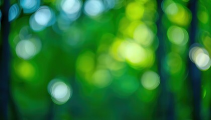 Obraz premium soft green forest bokeh with bright light spots natural blurred foliage background for tranquil designs or nature themed projects