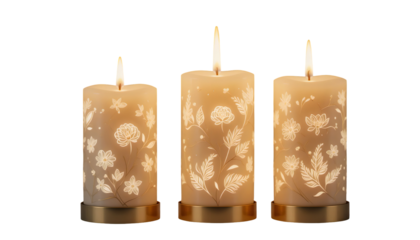 Three Glowing Pillar Candles with Floral Etchings on transparent background