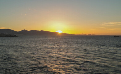 Scenic panoramic seascape view of Ocean and clouds and blue hour twilight sky in Piraeus Athens, Greece seen from outdoor deck of luxury cruiseship cruise ship liner