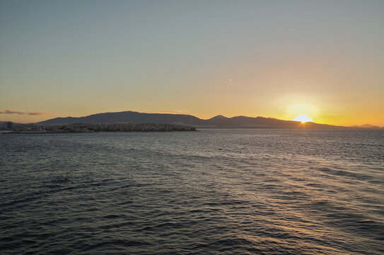 Fototapeta Scenic panoramic seascape view of Ocean and clouds and blue hour twilight sky in Piraeus Athens, Greece seen from outdoor deck of luxury cruiseship cruise ship liner
