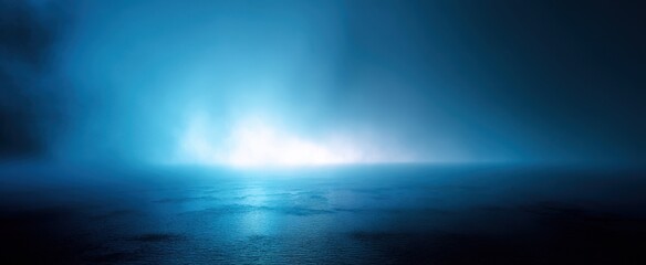 Fototapeta premium The serene ocean enveloped in mysterious blue fog at twilight.