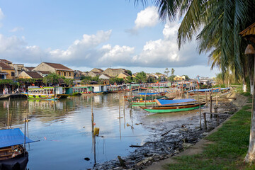 Happy european family, visting Hoi An city in Vietnam for a summer vacation, trying traditional food na watching the show in Memories Land