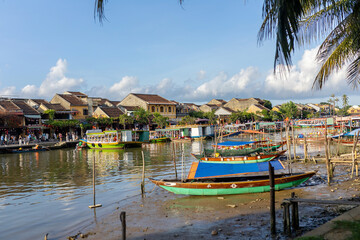 Happy european family, visting Hoi An city in Vietnam for a summer vacation, trying traditional food na watching the show in Memories Land